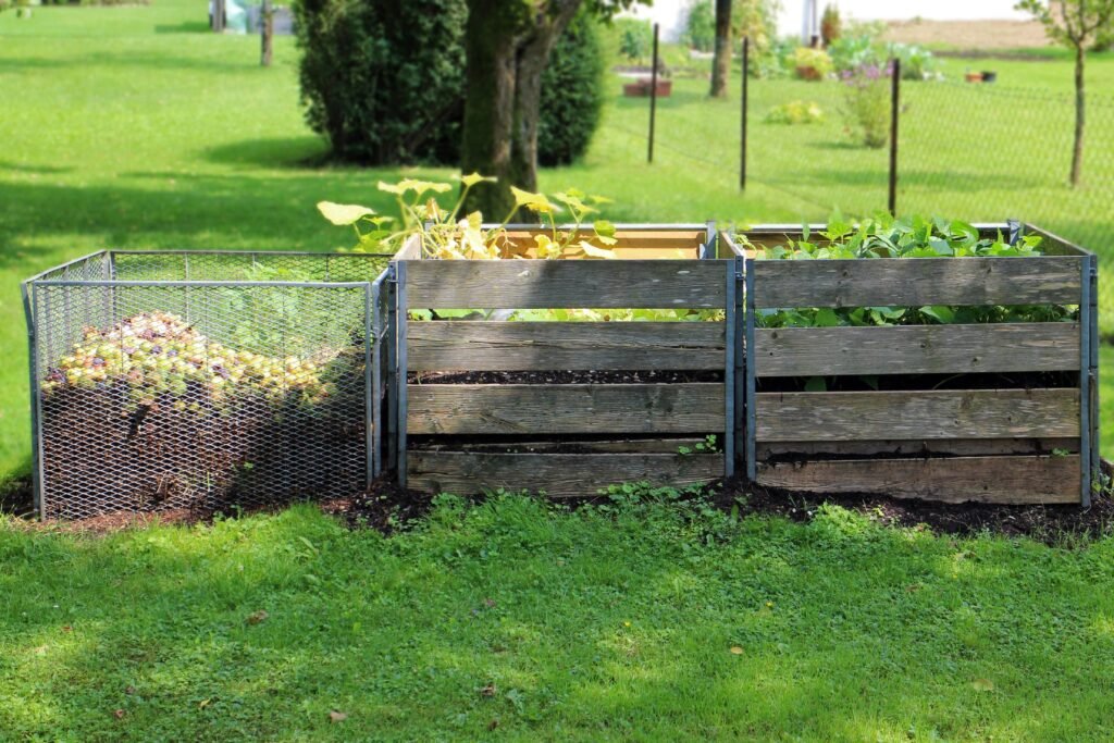 A compost bin setup in a rural backyard.