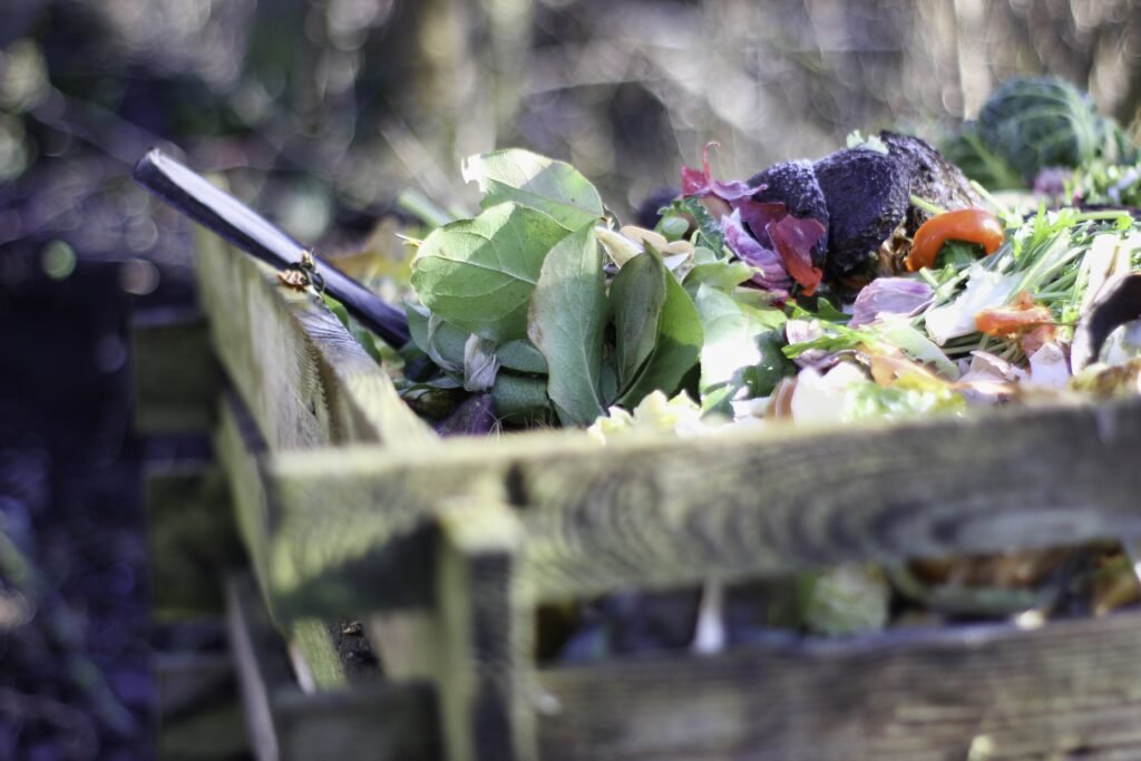 A compost pile with a mix of green and brown materials.